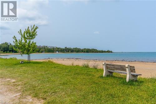 Gobles Grove Beach offers a shallow, protected bay with warm waters for swimming. - 3 George Street, Saugeen Shores, ON - Outdoor With Body Of Water With View