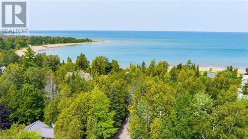 A bird's eye view of the protected crescent of Gobles Grove Beach. - 3 George Street, Saugeen Shores, ON - Outdoor With Body Of Water With View
