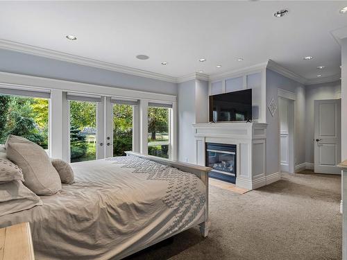 2050 Troon Crt, Langford, BC - Indoor Photo Showing Bedroom With Fireplace