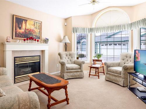 21-2710 Allenby Way, Vernon, BC - Indoor Photo Showing Living Room With Fireplace