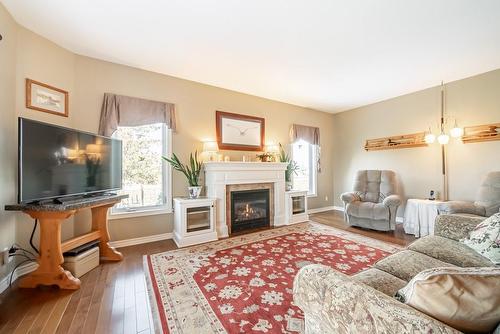 Spacious living room with gorgeous gas fireplace - 24 Lakeridge Boulevard, Lowbanks, ON - Indoor Photo Showing Living Room With Fireplace