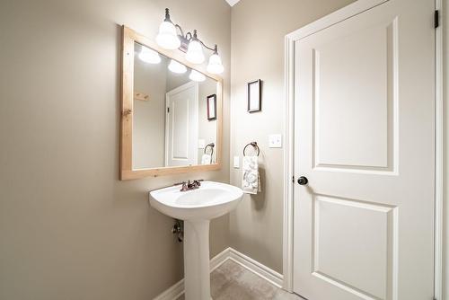 Powder room on main floor - 24 Lakeridge Boulevard, Lowbanks, ON - Indoor Photo Showing Bathroom