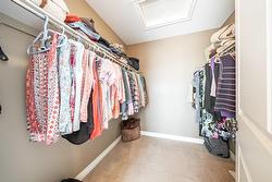Walk in closet located in primary bedroom - 