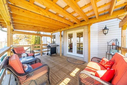 Covered back porch that leads to the above ground pool! - 24 Lakeridge Boulevard, Lowbanks, ON - Outdoor With Deck Patio Veranda With Exterior