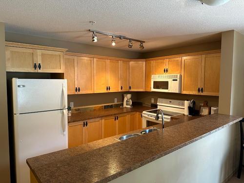 110 - 4874 Stanley Street, Radium Hot Springs, BC - Indoor Photo Showing Kitchen With Double Sink