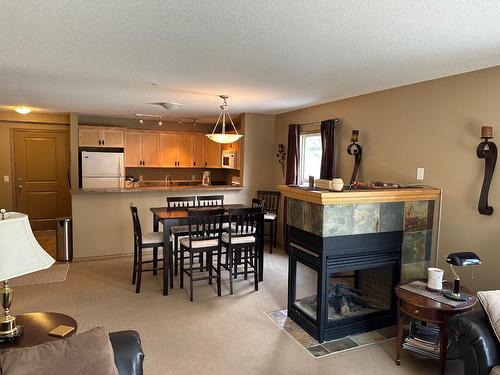 110 - 4874 Stanley Street, Radium Hot Springs, BC - Indoor With Fireplace
