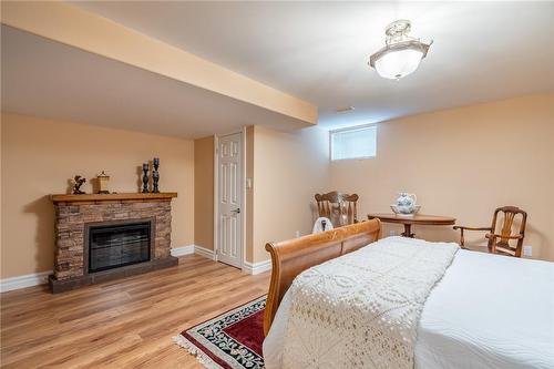 61 Aberdeen Avenue, Mount Hope, ON - Indoor Photo Showing Bedroom With Fireplace
