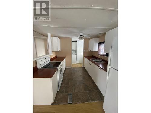 5220 44 Street, Fort Nelson, BC - Indoor Photo Showing Kitchen With Double Sink