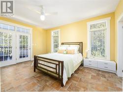 Primary bedroom features a walkout to the covered deck - 