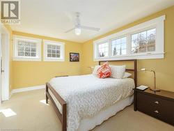 Third bedroom features cozy carpeting, closet and ensuite bath - 
