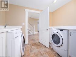 Convenient laundry room with plenty of storage - 