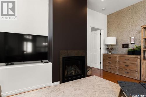 903 1901 Victoria Avenue, Regina, SK - Indoor Photo Showing Living Room With Fireplace