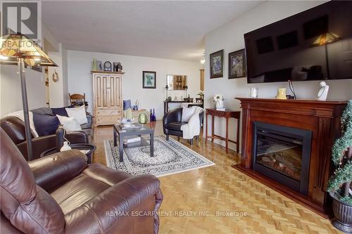 #908 -5 Lisa St, Brampton, ON - Indoor Photo Showing Living Room With Fireplace