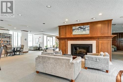 500 Laurier Avenue W Unit#1405, Ottawa, ON - Indoor Photo Showing Living Room With Fireplace