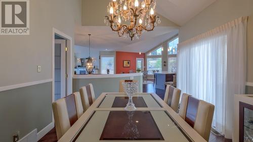 136 Sumac Ridge Drive, Summerland, BC - Indoor Photo Showing Dining Room With Fireplace