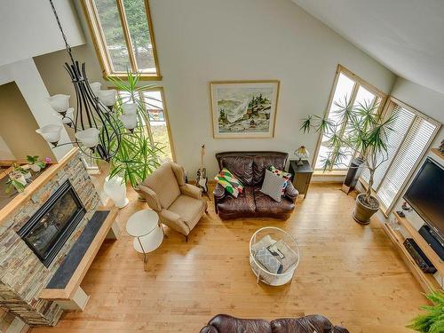 Overall view - 56 Rue Du Domaine-De-La-Marquise, Saint-Sauveur, QC - Indoor Photo Showing Living Room With Fireplace