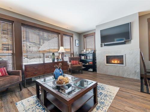 2108-375 Raven Ridge Road, Big White, BC - Indoor Photo Showing Living Room With Fireplace