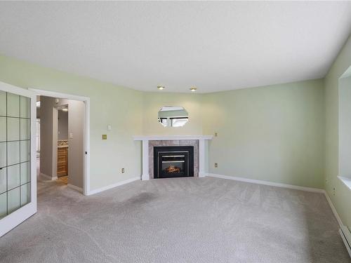 112-635 Blenkin Ave, Parksville, BC - Indoor Photo Showing Living Room With Fireplace