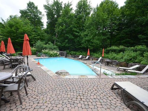 Pool - 2-1510 Ch. Du Versant-Soleil, Mont-Tremblant, QC - Outdoor With In Ground Pool With Backyard
