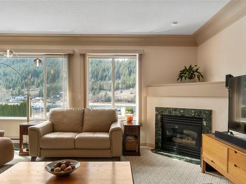 303-1002 Riverside Avenue, Sicamous, BC - Indoor Photo Showing Living Room With Fireplace
