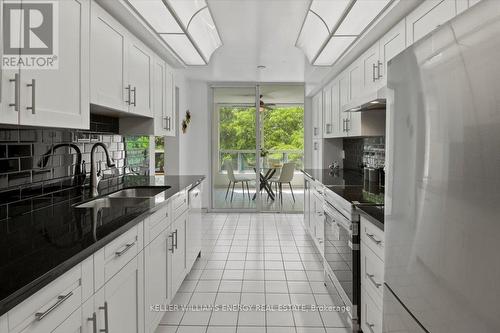 312 - 4727 Sheppard Avenue E, Toronto, ON - Indoor Photo Showing Kitchen With Double Sink With Upgraded Kitchen