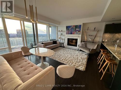 #4203 -180 University Ave, Toronto, ON - Indoor Photo Showing Living Room With Fireplace