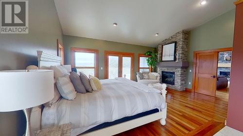 14154 Smith Road, Fort St. John, BC - Indoor Photo Showing Bedroom With Fireplace