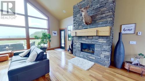 14154 Smith Road, Fort St. John, BC - Indoor Photo Showing Living Room With Fireplace