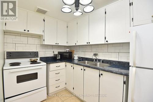 504 - 150 Charlton Avenue E, Hamilton, ON - Indoor Photo Showing Kitchen With Double Sink