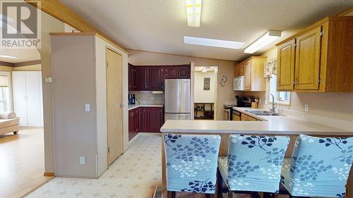 10285 Lily Street, Fort St. John, BC - Indoor Photo Showing Kitchen With Double Sink