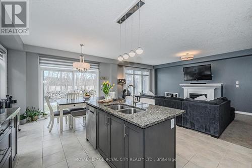 188 Sammon Dr, Guelph/Eramosa, ON - Indoor Photo Showing Kitchen With Fireplace With Double Sink