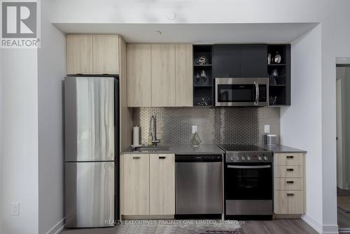 #1405 -10 De Boers Dr, Toronto, ON - Indoor Photo Showing Kitchen With Stainless Steel Kitchen