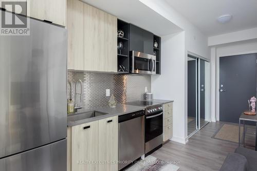 #1405 -10 De Boers Dr, Toronto, ON - Indoor Photo Showing Kitchen With Stainless Steel Kitchen With Upgraded Kitchen