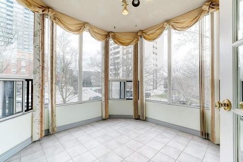 Bright Sunroom with floor to ceiling windows. - 2121 Lakeshore Road|Unit #307, Burlington, ON - Indoor Photo Showing Other Room