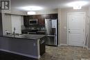 406 304 Petterson Drive, Estevan, SK  - Indoor Photo Showing Kitchen With Double Sink 