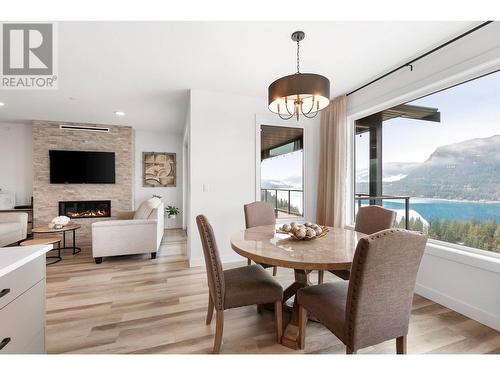226 Sunset Drive, Sicamous, BC - Indoor Photo Showing Dining Room With Fireplace