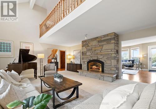 28 Golf Club Crescent, Kawartha Lakes, ON - Indoor Photo Showing Living Room With Fireplace
