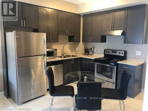 705 - 2486 Old Bronte Road, Oakville, ON - Indoor Photo Showing Kitchen With Stainless Steel Kitchen With Double Sink