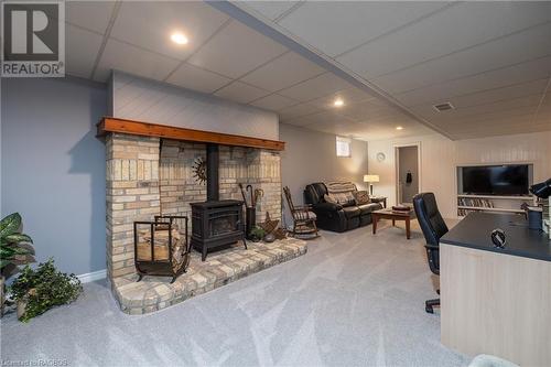 Finished Basement with Natural Gas Fireplace and Separate Walk-Up entrance to garage. - 247 Penetangore Row, Kincardine, ON - Indoor With Fireplace