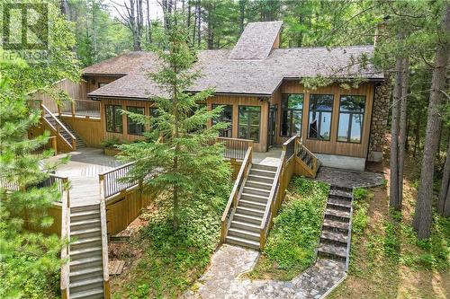 Private setting surrounded by mature trees - 27 Rocky Shores Lane, Round Lake Centre, ON - Outdoor