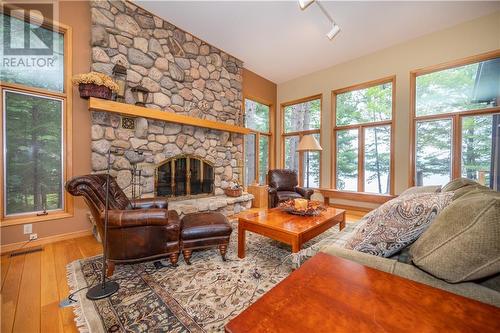 27 Rocky Shores Lane, Round Lake Centre, ON - Indoor Photo Showing Living Room With Fireplace