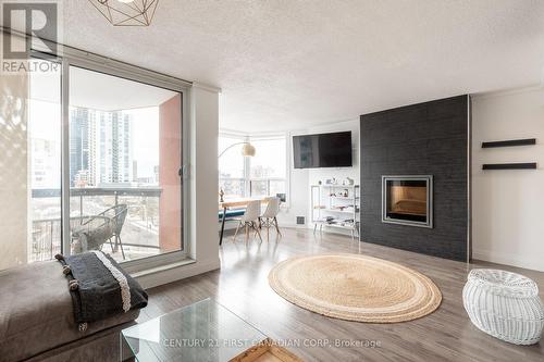 #810 -600 Talbot St, London, ON - Indoor Photo Showing Living Room With Fireplace