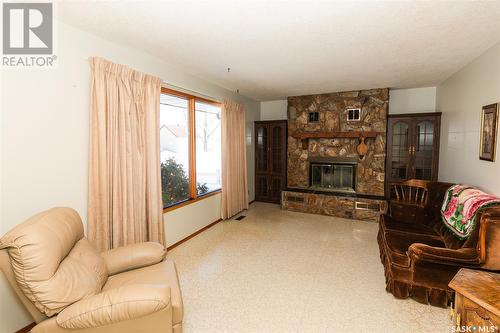 105 Bayne Street, Luseland, SK - Indoor Photo Showing Living Room With Fireplace