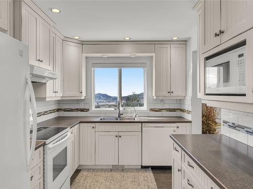 6895 Farmers Drive, Kelowna, BC - Indoor Photo Showing Kitchen With Double Sink