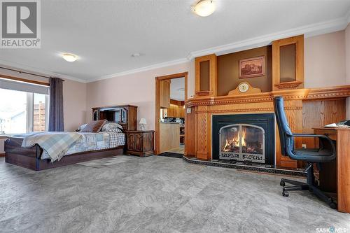 576 Okanese Avenue S, Fort Qu'Appelle, SK - Indoor Photo Showing Bedroom With Fireplace