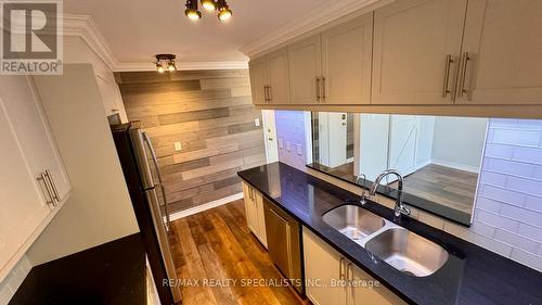 #217 -4185 Shipp Dr, Mississauga, ON - Indoor Photo Showing Kitchen With Double Sink