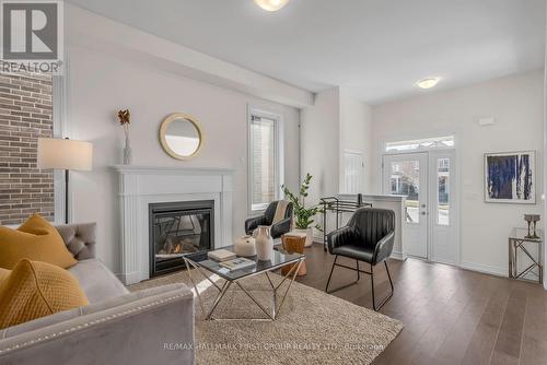 33 Mountainside Crescent, Whitby, ON - Indoor Photo Showing Living Room With Fireplace