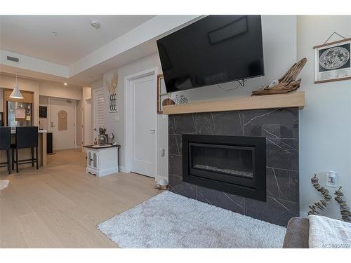 305-9861 Third St, Sidney, BC - Indoor Photo Showing Living Room With Fireplace