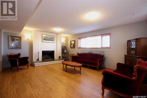 220 Battleford Trail, Swift Current, SK - Indoor Photo Showing Living Room With Fireplace
