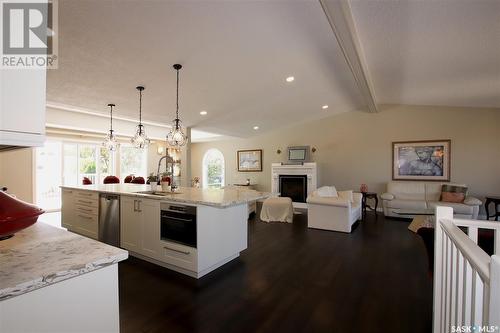 220 Battleford Trail, Swift Current, SK - Indoor Photo Showing Living Room With Fireplace